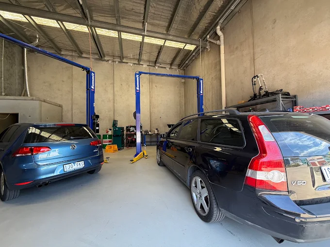 Inside the Kaka Autocare workshop, with cars on the hoists